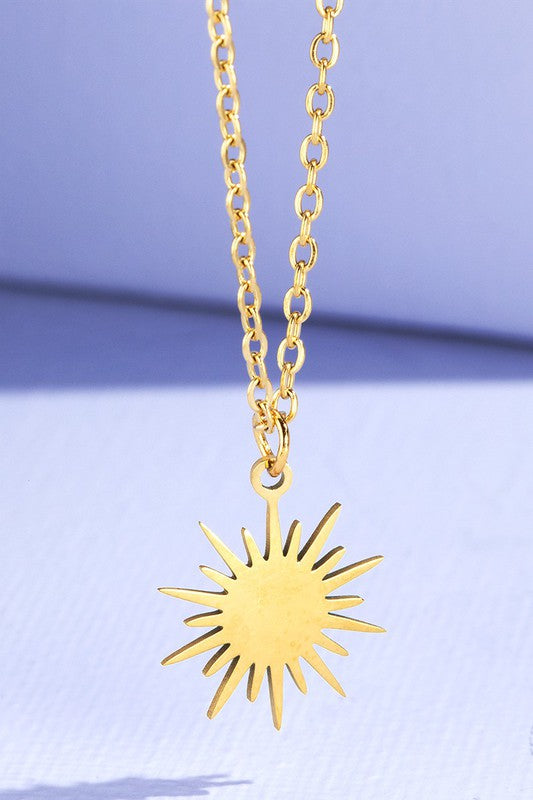 gold starburst necklace. 
