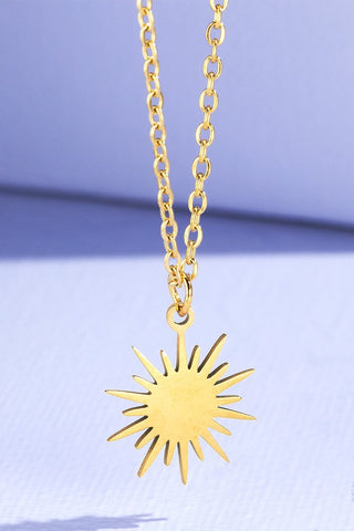 gold starburst necklace. 